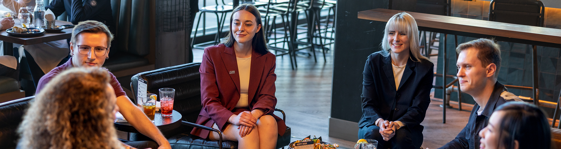 People talking sitting in a small coffee table